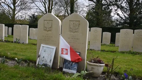 Close Up Of A Polish Flag On A Commonwealth War Graves At The Nieuwe Ooster G Stock Footage 127670803