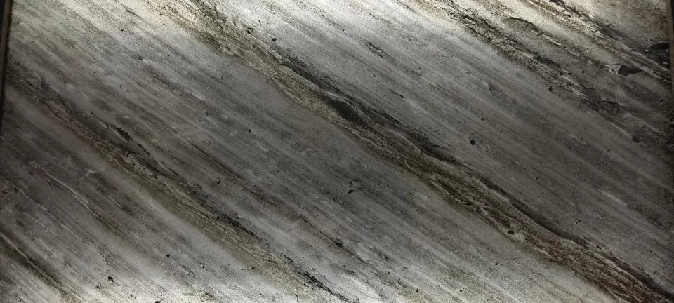 Close‑up of polished stone surface with diagonal streaks Fotos Stock