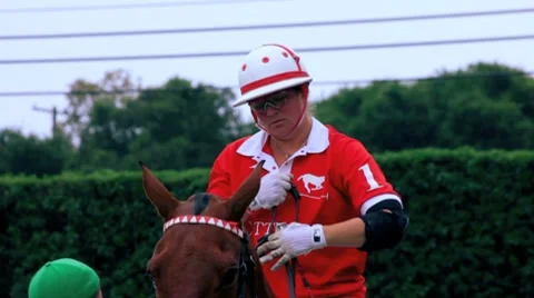 CLOSE-UP POLO PLAYER GETS READY FOR MATCH Stock-Footage 7135420