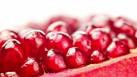 A close up of a pomegranate with many small red seeds Stock Footage 327702673