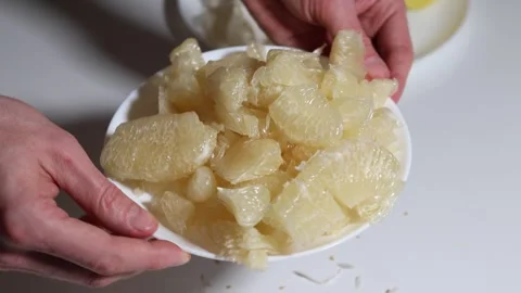 Close-up of pomelo segments, prepared, citrus, healthy snack. Stock Footage 326977694