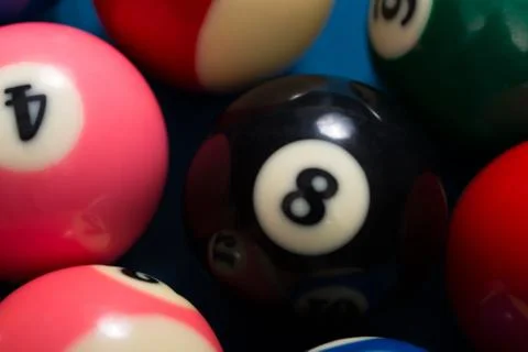 Close-up of pool balls on blue pool table Foto stock