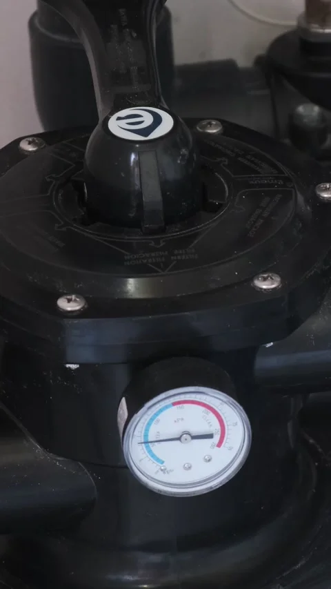 Close-up of a pool filtration valve system with connected plastic pipes and a bu Stock Footage 312019039