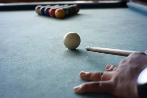 Close up of the pool player's hand preparing to start the game Stock Photos