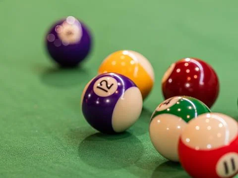 Close-up of a pool table with vibrant billiard balls, inviting a game of pr.. 写真素材