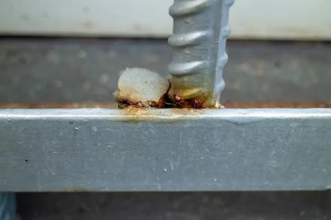 Close-up of poor welding work on rebar and steel beam joint showing rust Stock Photos