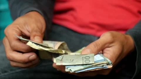 Close up of a poor worker counting banknotes Video stock 319942501