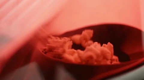 Close up, pop corn machine as corn is popping Stock Footage 22391157