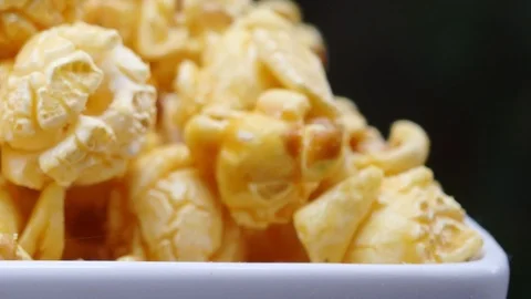 Close up popcorn black background pan Stock-Footage 121511212