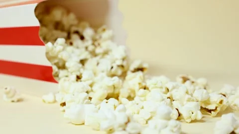 Close up, popcorn bucket falling in slow motion Video stock 288828751