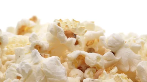Close-up of popcorn pile isolated on the white background. Stock Footage 157821163