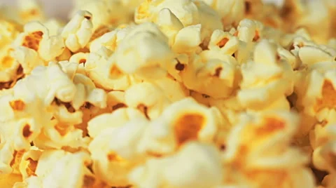 Close-up of popcorn pours down and fills the frame. Stock Footage 65003238