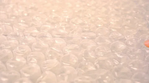 Close up of popping the bubbles in bubble wrap. Macro video shift motion Stock-Footage 39815941