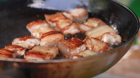 Close up of pork belly fried on a pan Stock Footage 262774667