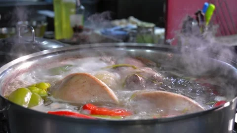 Close-up of pork knuckle with vegetables cooked in boiling water Stock Footage 267280228
