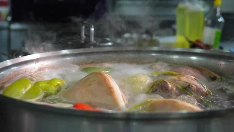 Close-up of pork knuckle with vegetables cooked in boiling water Stock Footage 267291569