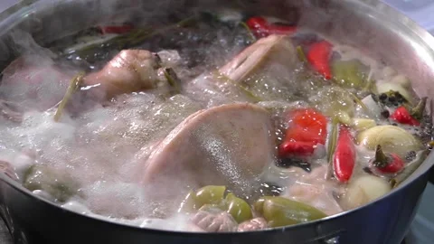 Close-up of pork knuckle with vegetables cooked in boiling water Stock Footage 267294447