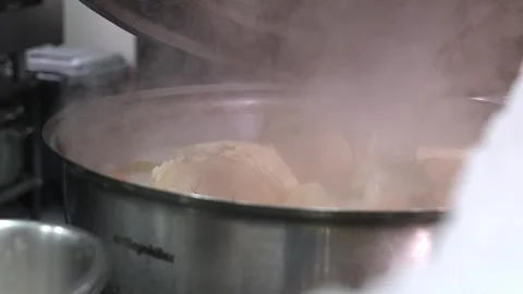 Close-up of pork knuckle with vegetables cooked in boiling water Video stock 267669502
