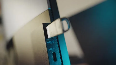 Close up on portable flash drive device plugged into computer or screen Stock Footage 335241505