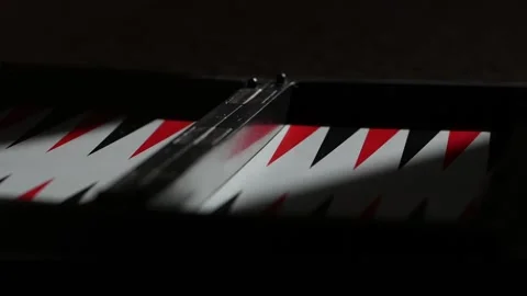Close-up portable folding magnetic backgammon red and blackм Vídeos de archivo 130265487