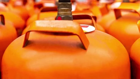 Close up of Portable orange refilling gas cylinders in transportation car Stock Footage 288989000
