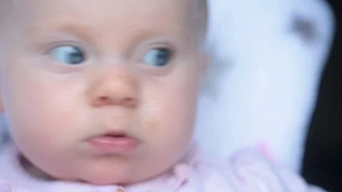 Close up portrait of 5 month old Beautiful Baby Girl with baby Food on her Face, Video stock 115756152