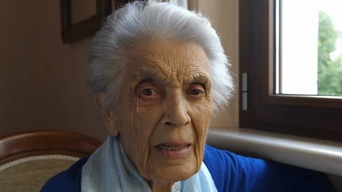 Close-up portrait of an 80-year old woman looking straight Stock Footage 95622952