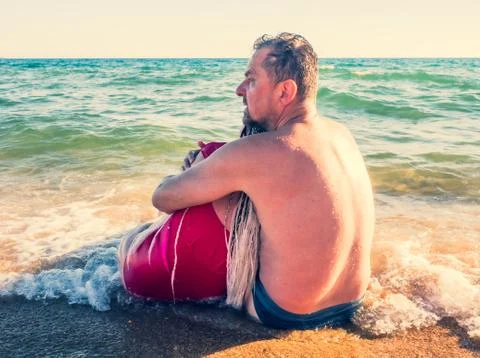 Close up portrait of affectionate middle-aged couple on summer holiday. Hands Stock Photos
