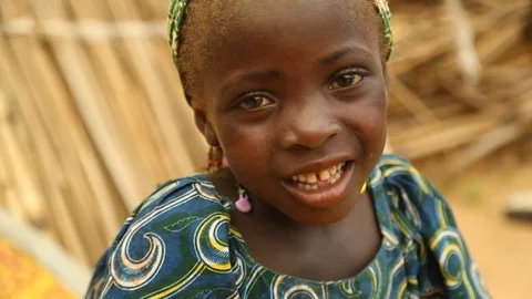 Close up portrait of an African girl laughing - Nigeria Stock Footage