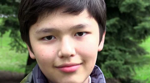 Close up portrait of Asian  boy smiling at the camera Stock Footage 43668643