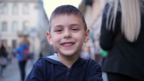 Close-up portrait of a attractive boy standing in the city street. Stock-Footage 194564805