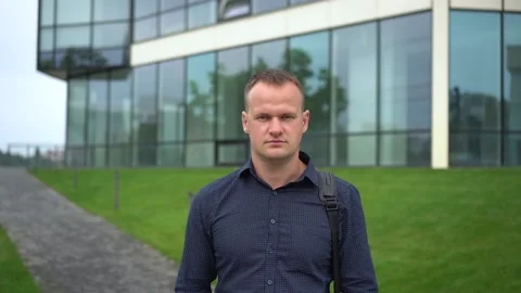Close up portrait attractive young man. A serious hired employee. Stock Footage 113554345
