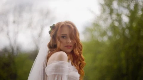 Close-up portrait attractive young red girl looking at the camera. Luxury Stock Footage 247215348