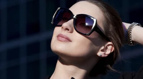 Close-up portrait attractive young walking business woman in sunglasses Stock-Footage 64743370