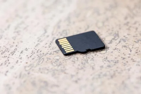 A close up portrait of the back of a black micro SD card, the connectors of t Stock Photos