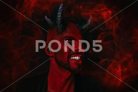A close-up portrait of a bad demon. Horror movie, nightmare. Halloween. Stock Photos