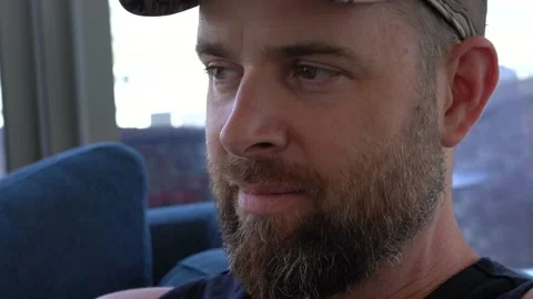 Close up portrait of a bearded middle age man watching tv 스톡 동영상 150142136