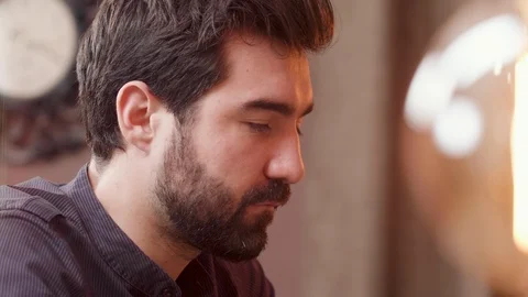 Close up portrait of a bearded young man having a conversation Video stock 106703428