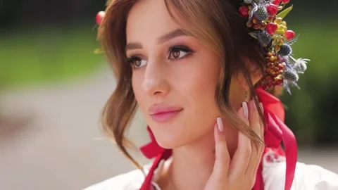 Close up Portrait of Beautiful bride dressed in ukrainian ethno clothes. Woman Stock Footage 233328089