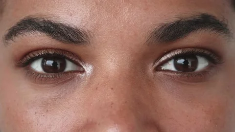 Close-up portrait of a beautiful multi-ethnic young woman's eyes, expressing Stock Footage 204832266