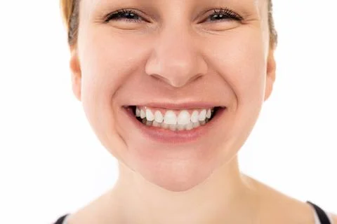 Close-up portrait of a beautiful young middle-aged woman with a snow-white smile Stock Photos