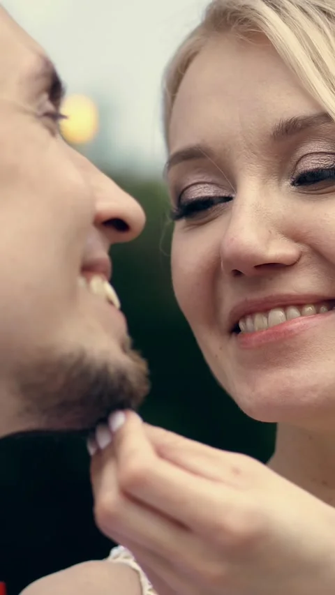 Close-up, portrait, the bride gently strokes the groom's beard. Look at each Stock Footage 317316816