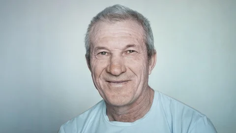 Close-up portrait of a brooding elderly man looking into the camera Stock Footage 113141157