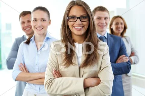 Close-up portrait of a business group with a female leader in the foreground Stock Photos