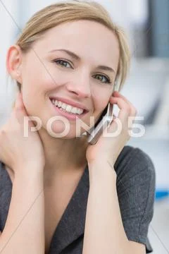 Close-up portrait of business woman using mobile phone Stock Photos