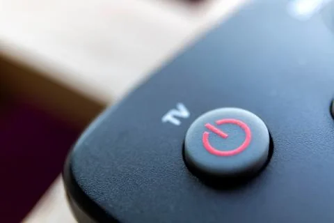 A close up portrait of an on off button of a remote control for turning on a  Foto stock