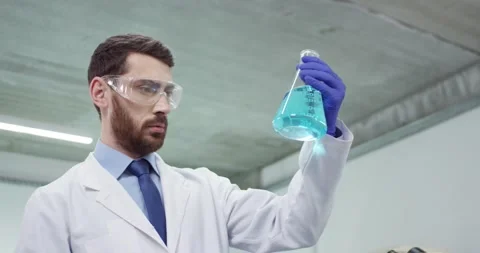 Close up portrait of Caucasian experienced bearded male lab scientist in goggles Stock Footage 147228935