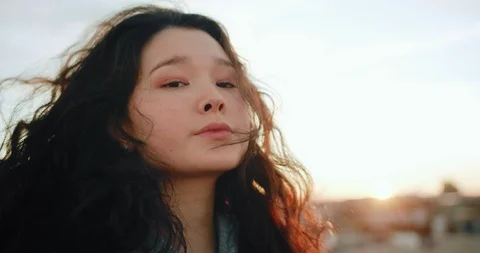Close up portrait of charming Asian face of beautiful young natural female Stock Footage 125308678