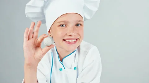 Close up portrait chef cook girl looking at quail egg and smiling at camera Stock Footage