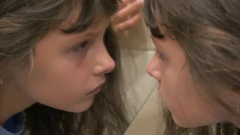 Close-up portrait of a child in front of a mirror. Stock Footage 231927058